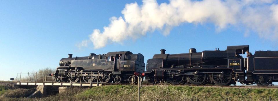 Steam train beside the site