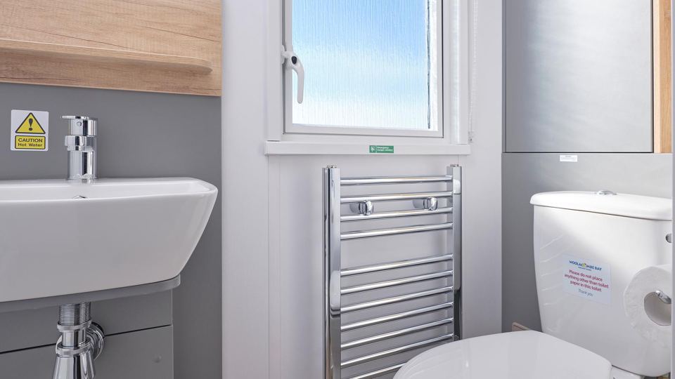 Bathroom with basin and heated rail