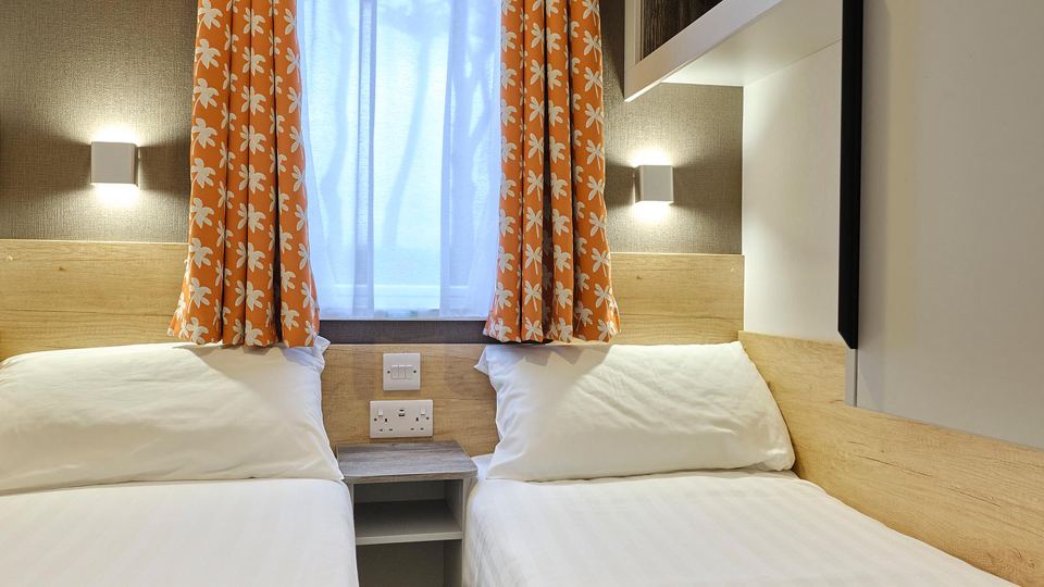 Twin beds under the window