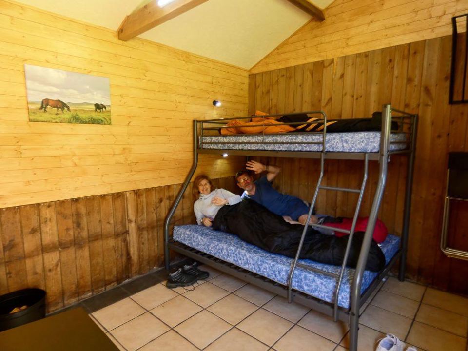 Bunk room with pine walls