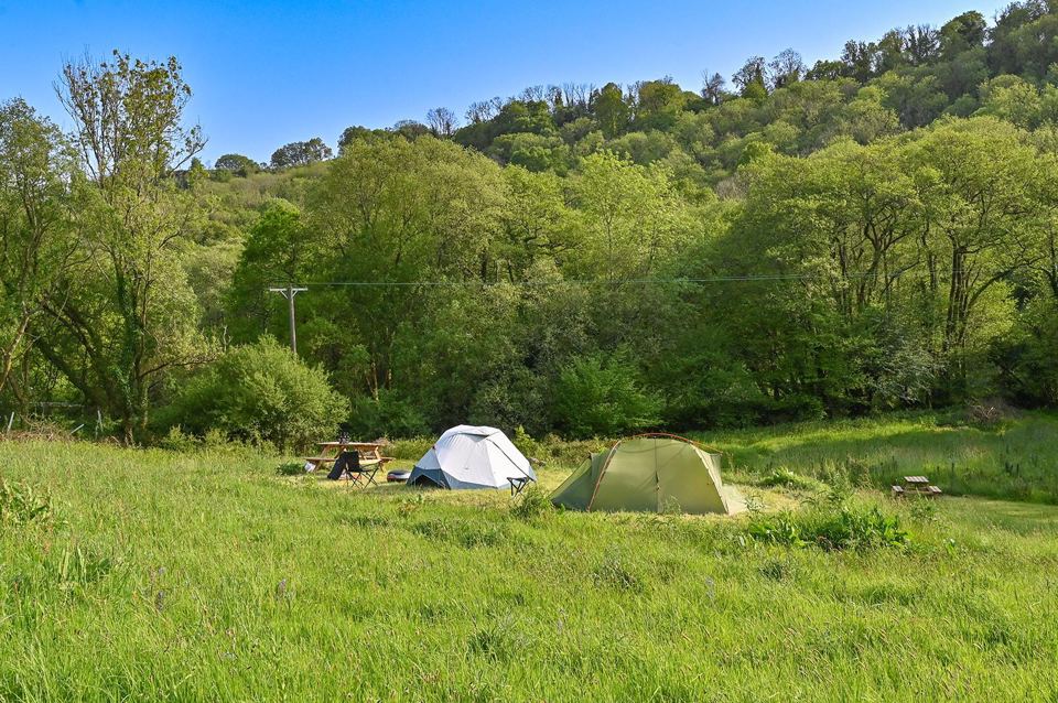 Tents in the valley meadow