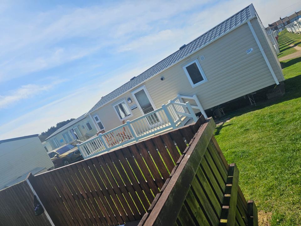 Caravan behind a fence