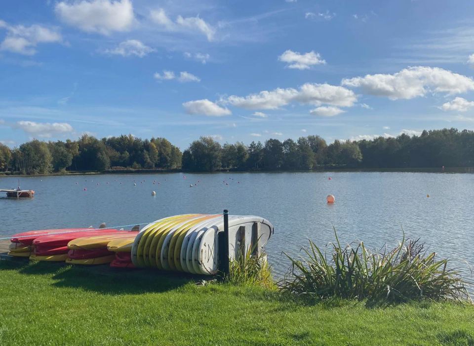 Lake with kayaks nearby